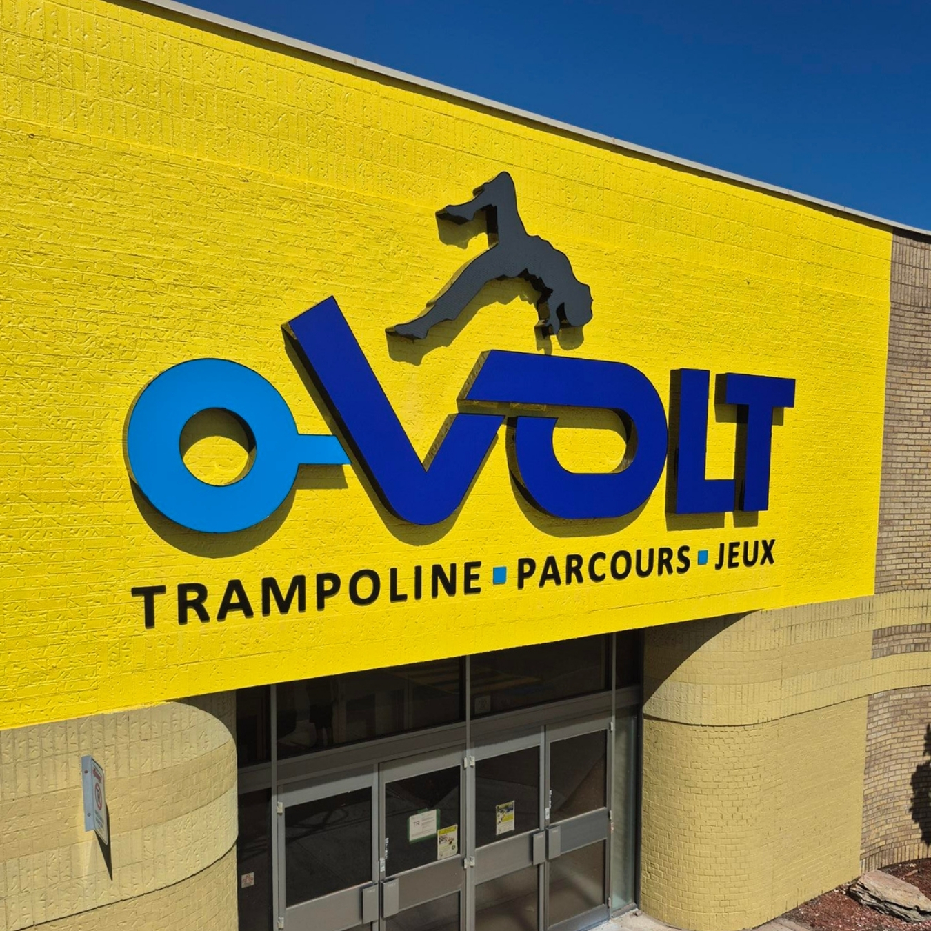 Letters channel on building for O-Volt in Montreal